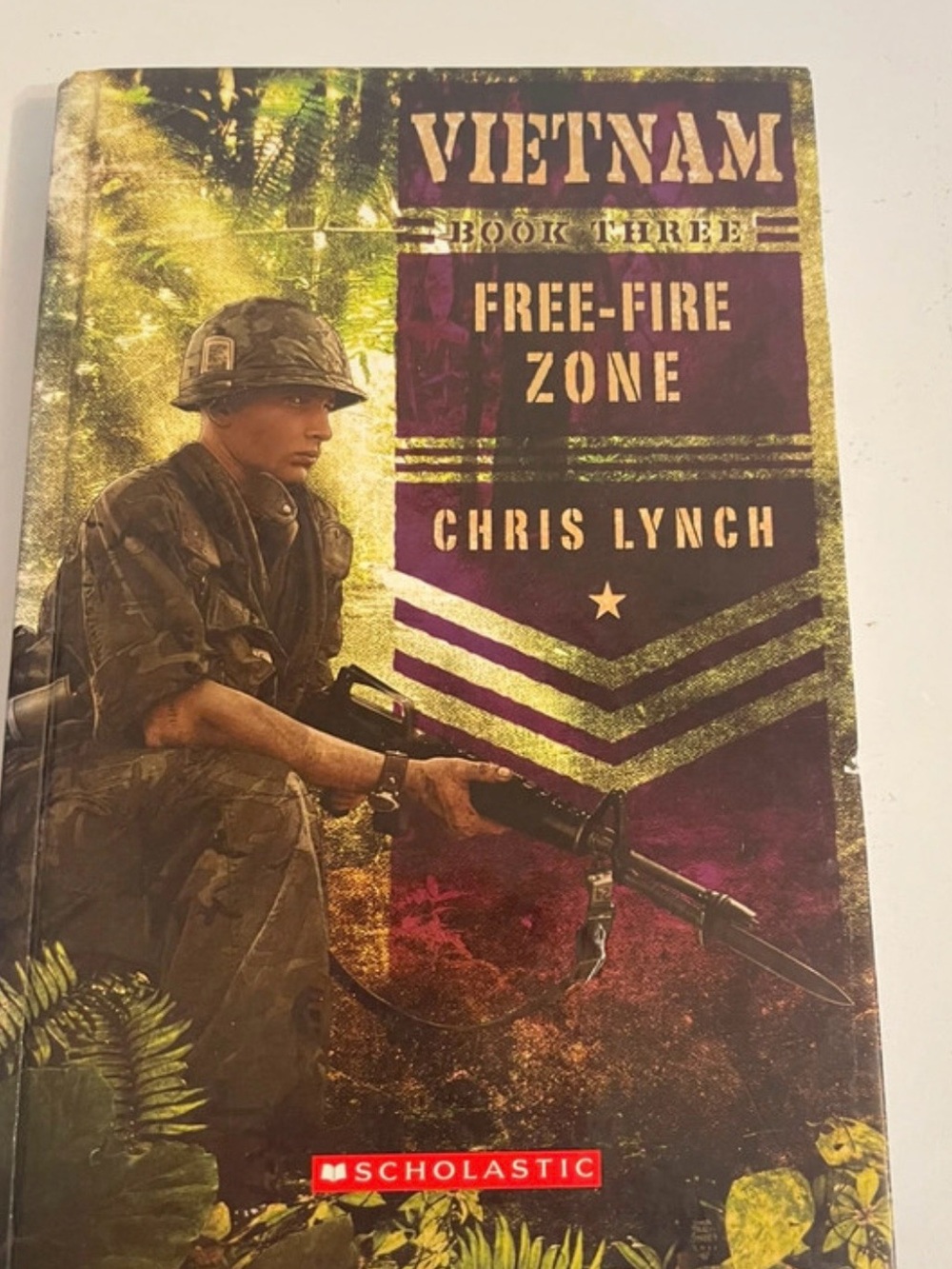 Scholastic Paperback Back Cover in Purple and Olive Green